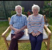 Judith and Alan sat on theie bench